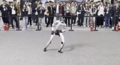 A humanoid robot mid-dance move at the IROS 2025 competition