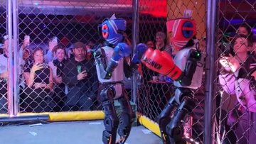 Humanoid Robots Duke It Out in Cyberpunk Cage Match
